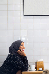 Black Muslim Woman in cafe