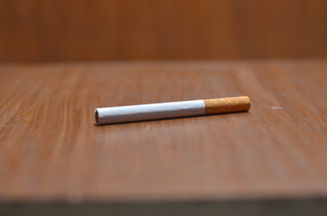 Close-Up Of several Cigarette on wooden background