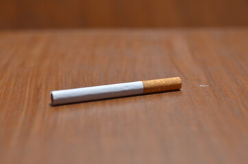 Close-Up Of several Cigarette on wooden background