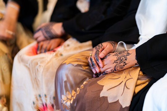 Black Muslim girls showing henna in traditional dress