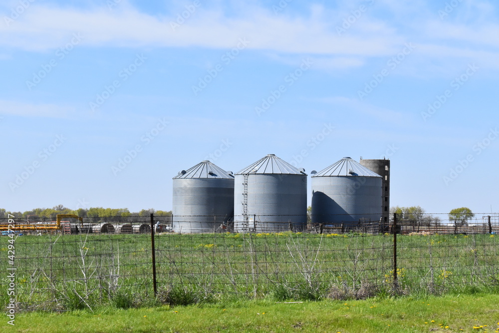 Canvas Prints grain bins in a field