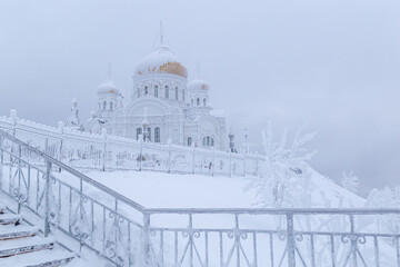 Belogorsk monastery on the mountain in winter, covered with white snow and frost. Belogorye, Perm Territory, Ural, Russia