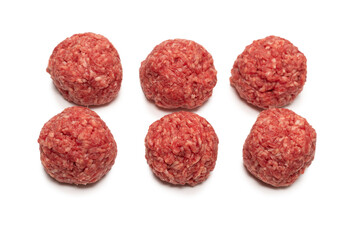 Raw meat balls isolated on white background.