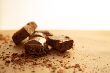 chocolate bars, chocolate chips on a brown background