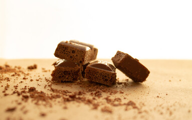 chocolate bars, chocolate chips on a brown background