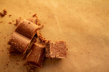 chocolate bars, chocolate chips on a brown background