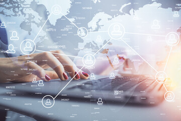 Double exposure of woman hands typing on computer and social network theme hologram drawing. People media concept.