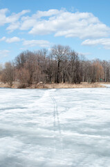 Panoramic view of the island and the ice-covered lake. A bright sunny day.