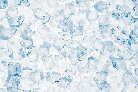Ice cubes blue background. Heap of ice cubes on white background.