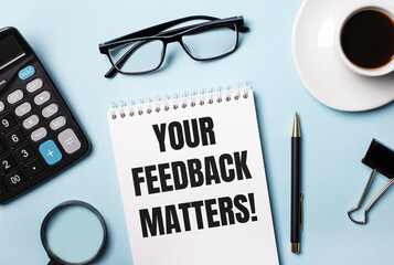 On a blue background, glasses, calculator, coffee, magnifier, pen and notebook with the text YOUR FEEDBACK MATTERS