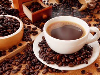 A hot coffee cup and sack of coffee beans with a full of coffee beans in the wood bowl