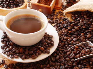 Coffee cup and sack of coffee beans on the table