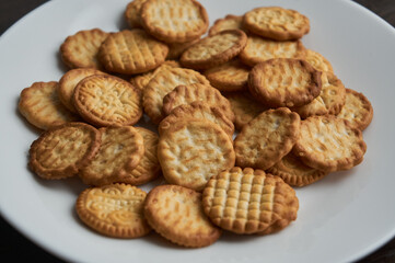 Small round dry cookies  on white plate