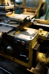 Buttons and remote control of machinery for human operation in the enterprise. Start button on the lathe.