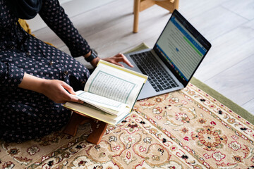Black Muslim Woman studying quran