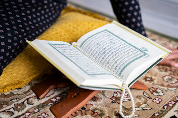 Black Muslim Woman studying quran