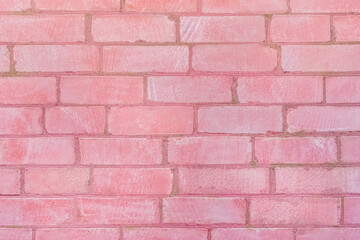 Obraz premium Pink color paint on old brick wall texture background