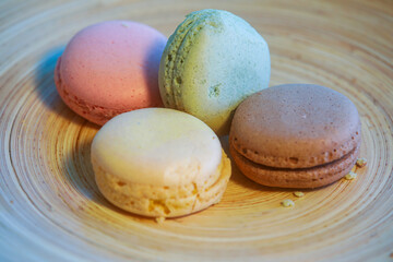 Macarons in different colours on a background