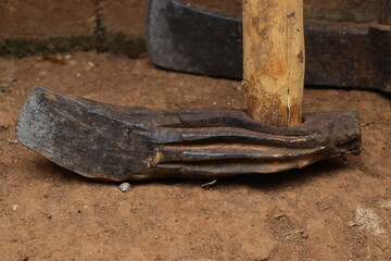 old axe with wooden handle used for woodcutting