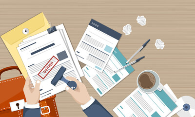 Hand stamps paper document with rejected stamp. Rejected document on wooden desk top view. Vector illustration in flat design style.