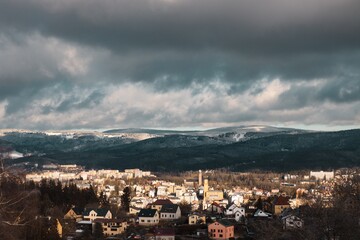 Fototapeta na wymiar Beautiful view from above on the city (Jablonec nad Nisou). Dramatic cloudy sky.