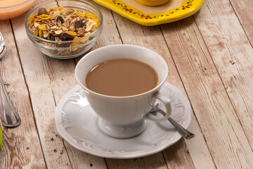cup of tea and cookies on wooden table