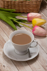 cup of coffee with milk and flowers