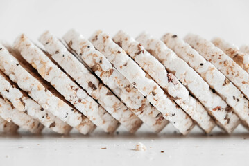Round diet crispbreads on a white background. Round shaped cereal bread, healthy food without yeast. Copy, empty space for text