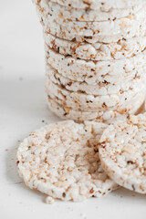 Round diet crispbreads on a white background. Round shaped cereal bread, healthy food without yeast. Copy, empty space for text