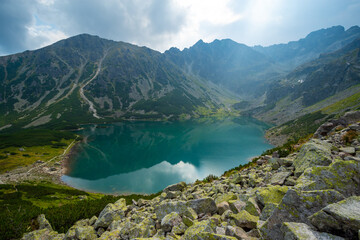 Fototapeta na wymiar emerald mountain lake in high Tatra mountains in Poland