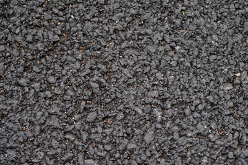 Bumpy old asphalt road background.