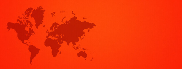 World map on red wall background. Horizontal banner