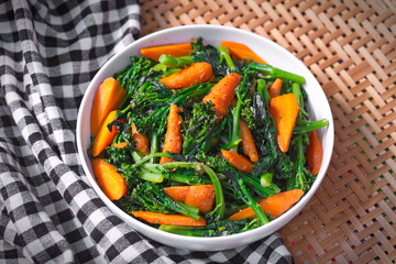 Fried baby broccoli mixed baby carrots
