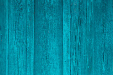 Obraz premium Old boards with scratches, cracks, bent nails, azure paint faded in the sun.