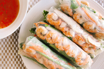 Dish of Spring rolls and sauce on the table
