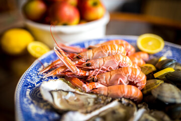Seafood (langoustines, oysters and clams) on plate