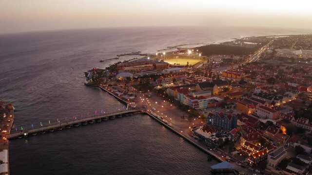 aerial drone image of the city of curacao in the caribbean at night