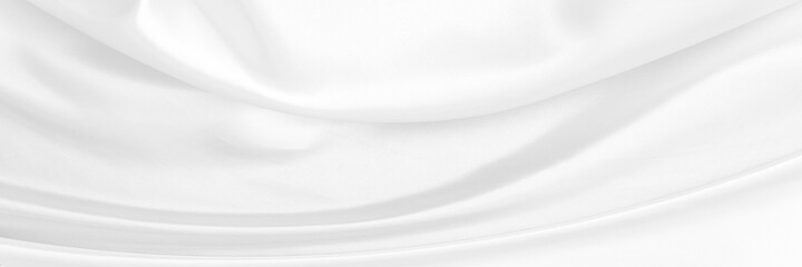 White gray satin texture that is white silver fabric silk panorama background with beautiful soft blur pattern natural.