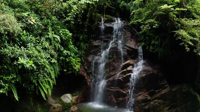 A beautiful waterfall named suyupacha found in a tropical forest around Tena, Ecuador in South America