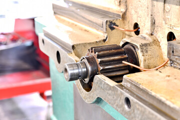 Broken and disassembled cnc machine. Repair of mechanical metalworking equipment.