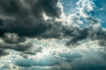 Light of the setting sun through the clouds
