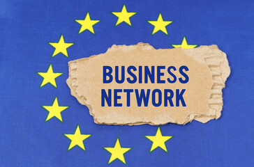 There is a cardboard box on the EU flag that says- BUSINESS NETWORK