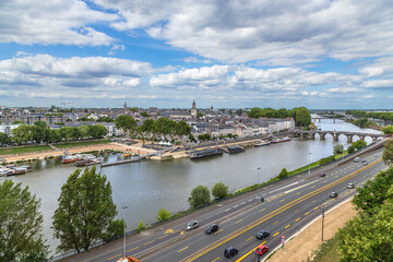 Obraz premium Angers, France. Scenic view of the embankment and the Maine river with bridges 
