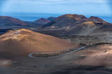 Fototapeta premium volcano in island landscape with a road, sea and sky