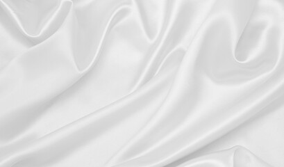 Obraz premium Smooth elegant white silk or satin luxury cloth texture as wedding background. Luxurious background design