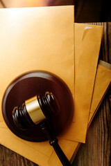 Women lawyer working with contract papers and wooden gavel on tabel in courtroom. justice and law ,attorney, court judge, concept.