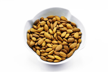Almonds inside a porcelain bowl. Perfect shot for breakfast, vegan living and wellness.