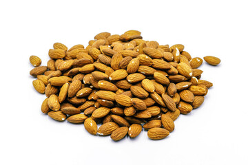 A group of shelled almonds on a white background. Perfect shot for vegan living, health and wellness.
