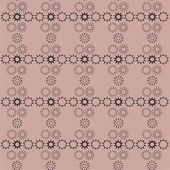 Seamless pattern with black suns on a dusty coral background. Vector