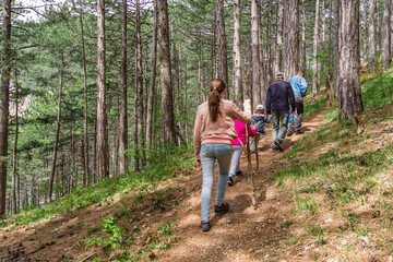 Obraz premium camping, travel, tourism, hike and people concept - happy family